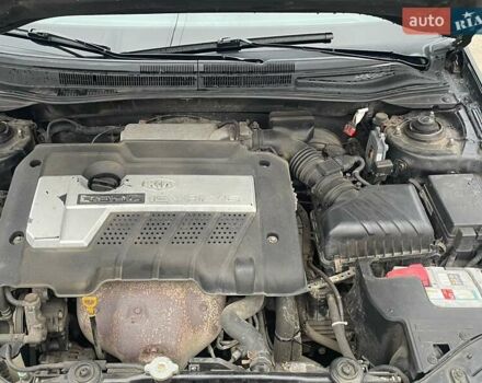 Черный Киа Черато, объемом двигателя 2 л и пробегом 318 тыс. км за 3900 $, фото 8 на Automoto.ua