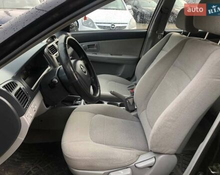 Чорний Кіа Черато, об'ємом двигуна 2 л та пробігом 177 тис. км за 4399 $, фото 12 на Automoto.ua