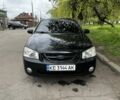 Чорний Кіа Черато, об'ємом двигуна 1.6 л та пробігом 271 тис. км за 4100 $, фото 1 на Automoto.ua