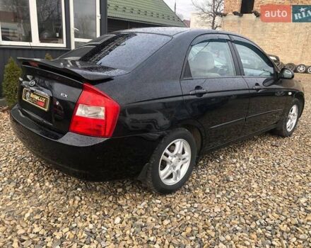 Чорний Кіа Черато, об'ємом двигуна 2 л та пробігом 177 тис. км за 4399 $, фото 7 на Automoto.ua