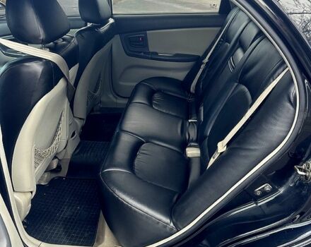 Черный Киа Черато, объемом двигателя 2 л и пробегом 232 тыс. км за 4100 $, фото 7 на Automoto.ua