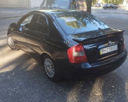 Черный Киа Черато, объемом двигателя 2 л и пробегом 220 тыс. км за 4900 $, фото 4 на Automoto.ua