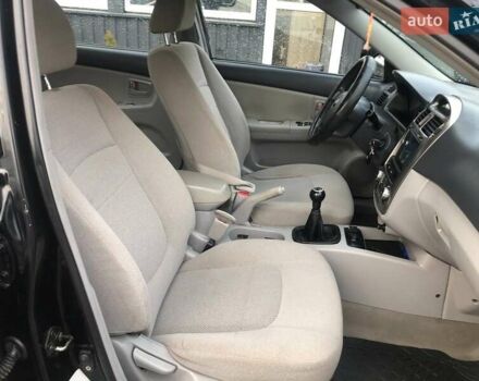 Чорний Кіа Черато, об'ємом двигуна 2 л та пробігом 177 тис. км за 4399 $, фото 24 на Automoto.ua