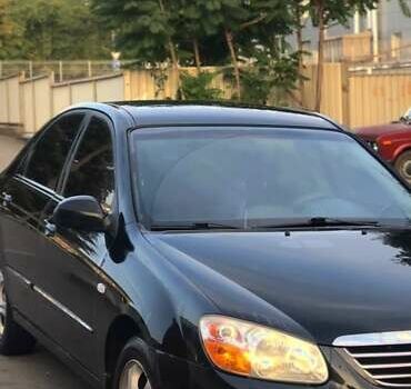 Черный Киа Черато, объемом двигателя 1.59 л и пробегом 273 тыс. км за 4200 $, фото 7 на Automoto.ua