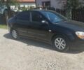 Черный Киа Черато, объемом двигателя 1.98 л и пробегом 246 тыс. км за 4600 $, фото 1 на Automoto.ua