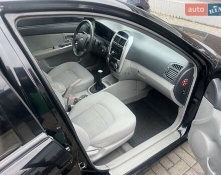 Черный Киа Черато, объемом двигателя 1.6 л и пробегом 180 тыс. км за 4900 $, фото 8 на Automoto.ua