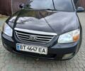 Черный Киа Черато, объемом двигателя 2 л и пробегом 250 тыс. км за 3700 $, фото 2 на Automoto.ua