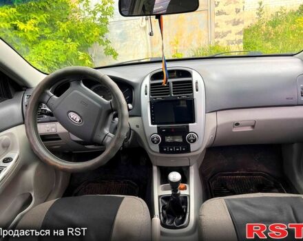 Черный Киа Черато, объемом двигателя 1.6 л и пробегом 207 тыс. км за 4500 $, фото 11 на Automoto.ua