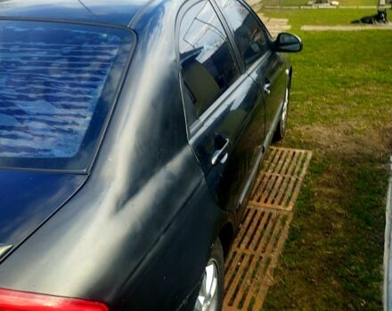 Черный Киа Черато, объемом двигателя 2 л и пробегом 215 тыс. км за 3000 $, фото 1 на Automoto.ua