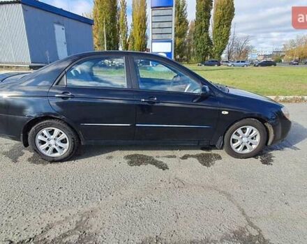 Черный Киа Черато, объемом двигателя 1.59 л и пробегом 349 тыс. км за 4000 $, фото 6 на Automoto.ua