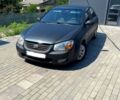 Черный Киа Черато, объемом двигателя 1.6 л и пробегом 322 тыс. км за 2500 $, фото 1 на Automoto.ua