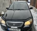 Черный Киа Черато, объемом двигателя 1.6 л и пробегом 270 тыс. км за 3650 $, фото 1 на Automoto.ua