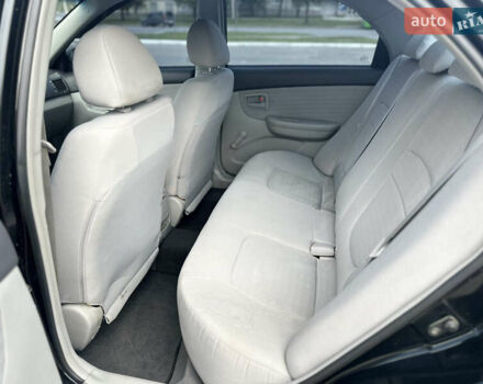 Чорний Кіа Черато, об'ємом двигуна 1.6 л та пробігом 272 тис. км за 5200 $, фото 14 на Automoto.ua