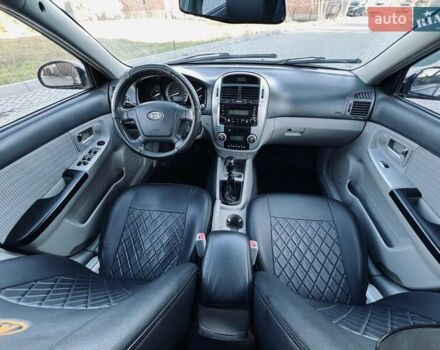 Черный Киа Черато, объемом двигателя 1.6 л и пробегом 210 тыс. км за 3650 $, фото 41 на Automoto.ua