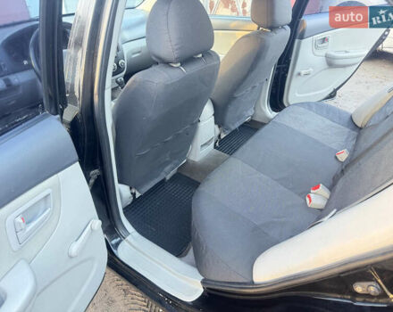 Чорний Кіа Черато, об'ємом двигуна 1.59 л та пробігом 250 тис. км за 4300 $, фото 11 на Automoto.ua