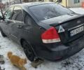 Черный Киа Черато, объемом двигателя 1.6 л и пробегом 236 тыс. км за 4100 $, фото 1 на Automoto.ua