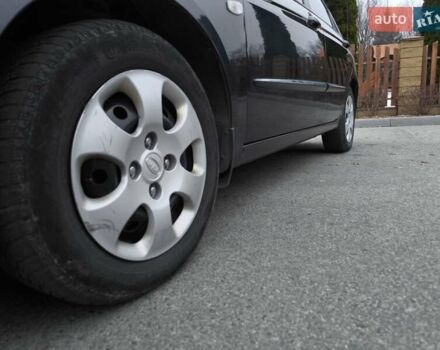 Чорний Кіа Черато, об'ємом двигуна 1.59 л та пробігом 300 тис. км за 4550 $, фото 12 на Automoto.ua