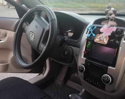 Черный Киа Черато, объемом двигателя 1.98 л и пробегом 246 тыс. км за 4600 $, фото 3 на Automoto.ua