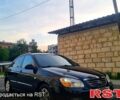 Черный Киа Черато, объемом двигателя 1.6 л и пробегом 185 тыс. км за 4200 $, фото 1 на Automoto.ua