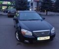 Черный Киа Черато, объемом двигателя 1.6 л и пробегом 228 тыс. км за 4000 $, фото 1 на Automoto.ua