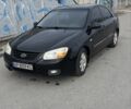 Черный Киа Черато, объемом двигателя 1.6 л и пробегом 258 тыс. км за 3300 $, фото 1 на Automoto.ua