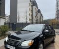 Черный Киа Черато, объемом двигателя 1.6 л и пробегом 256 тыс. км за 4200 $, фото 1 на Automoto.ua