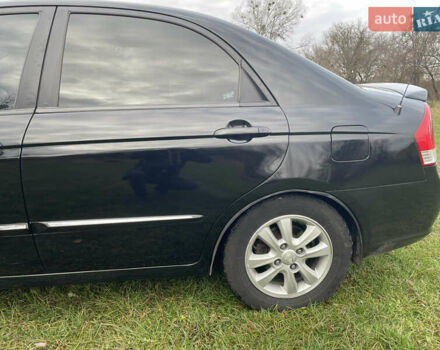 Черный Киа Черато, объемом двигателя 1.98 л и пробегом 315 тыс. км за 5745 $, фото 2 на Automoto.ua