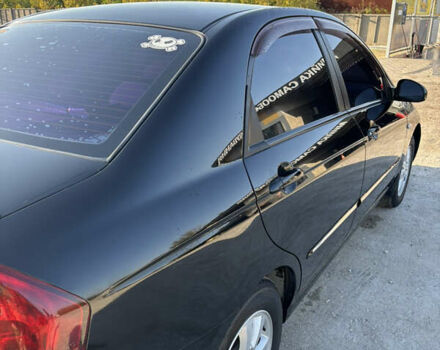 Черный Киа Черато, объемом двигателя 1.59 л и пробегом 314 тыс. км за 5000 $, фото 2 на Automoto.ua