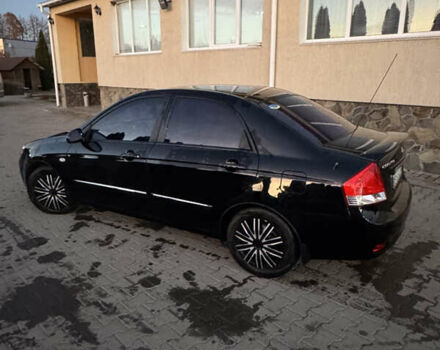 Чорний Кіа Черато, об'ємом двигуна 1.6 л та пробігом 197 тис. км за 5500 $, фото 2 на Automoto.ua