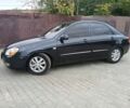 Черный Киа Черато, объемом двигателя 2 л и пробегом 250 тыс. км за 3700 $, фото 1 на Automoto.ua