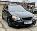 Черный Киа Черато, объемом двигателя 2 л и пробегом 360 тыс. км за 3900 $, фото 1 на Automoto.ua