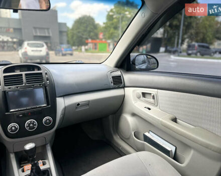 Чорний Кіа Черато, об'ємом двигуна 1.6 л та пробігом 272 тис. км за 5200 $, фото 13 на Automoto.ua