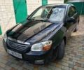 Чорний Кіа Черато, об'ємом двигуна 2 л та пробігом 249 тис. км за 6000 $, фото 1 на Automoto.ua