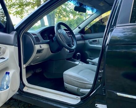 Черный Киа Черато, объемом двигателя 2 л и пробегом 302 тыс. км за 4600 $, фото 7 на Automoto.ua