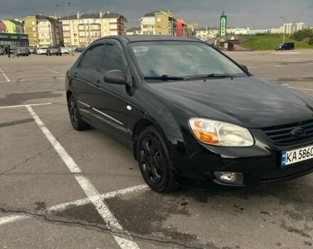 Черный Киа Черато, объемом двигателя 1.6 л и пробегом 292 тыс. км за 4000 $, фото 1 на Automoto.ua