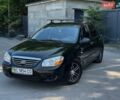 Черный Киа Черато, объемом двигателя 1.6 л и пробегом 127 тыс. км за 2800 $, фото 1 на Automoto.ua