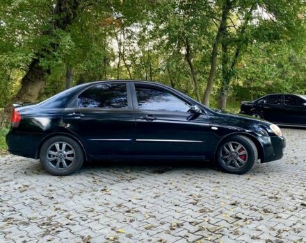 Черный Киа Черато, объемом двигателя 2 л и пробегом 302 тыс. км за 4600 $, фото 1 на Automoto.ua