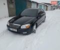 Чорний Кіа Черато, об'ємом двигуна 1.6 л та пробігом 230 тис. км за 4000 $, фото 1 на Automoto.ua