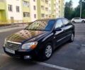 Черный Киа Черато, объемом двигателя 1.6 л и пробегом 200 тыс. км за 3999 $, фото 6 на Automoto.ua