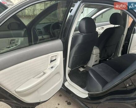 Черный Киа Черато, объемом двигателя 1.6 л и пробегом 230 тыс. км за 4950 $, фото 6 на Automoto.ua