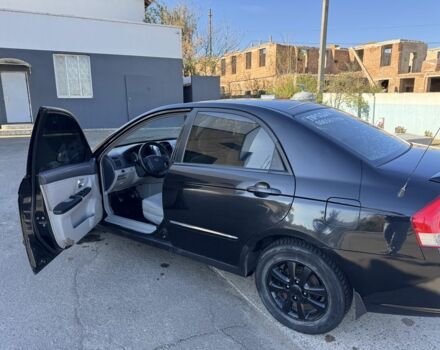 Чорний Кіа Черато, об'ємом двигуна 2 л та пробігом 362 тис. км за 3900 $, фото 5 на Automoto.ua