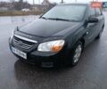 Черный Киа Черато, объемом двигателя 1.6 л и пробегом 260 тыс. км за 5200 $, фото 1 на Automoto.ua