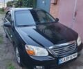 Чорний Кіа Черато, об'ємом двигуна 1.59 л та пробігом 240 тис. км за 4900 $, фото 1 на Automoto.ua