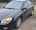 Чорний Кіа Черато, об'ємом двигуна 1.98 л та пробігом 189 тис. км за 5600 $, фото 1 на Automoto.ua