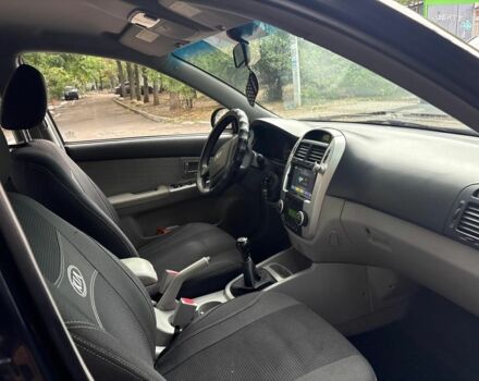 Черный Киа Черато, объемом двигателя 2 л и пробегом 250 тыс. км за 5000 $, фото 6 на Automoto.ua