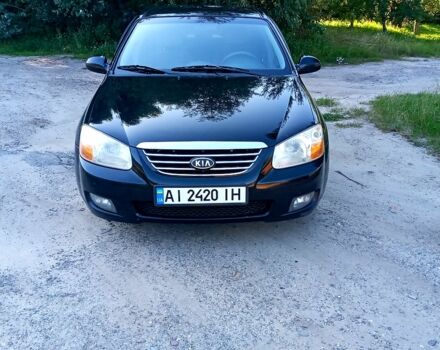 Чорний Кіа Черато, об'ємом двигуна 2 л та пробігом 203 тис. км за 5500 $, фото 1 на Automoto.ua