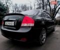 Черный Киа Черато, объемом двигателя 1.59 л и пробегом 300 тыс. км за 4700 $, фото 1 на Automoto.ua