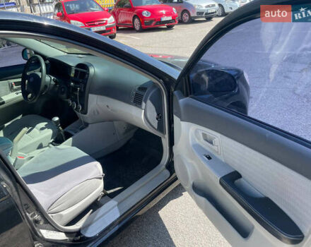Черный Киа Черато, объемом двигателя 1.59 л и пробегом 210 тыс. км за 4100 $, фото 7 на Automoto.ua