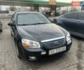Черный Киа Черато, объемом двигателя 1.6 л и пробегом 180 тыс. км за 4900 $, фото 1 на Automoto.ua