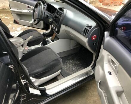 Черный Киа Черато, объемом двигателя 1.6 л и пробегом 240 тыс. км за 3300 $, фото 10 на Automoto.ua